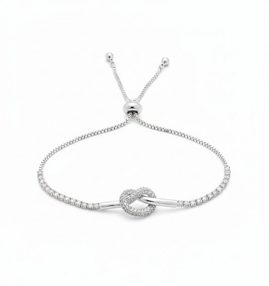 Silver Love Knot Bracelet – Adjustable CZ Tennis Chain by AurviJewelry
