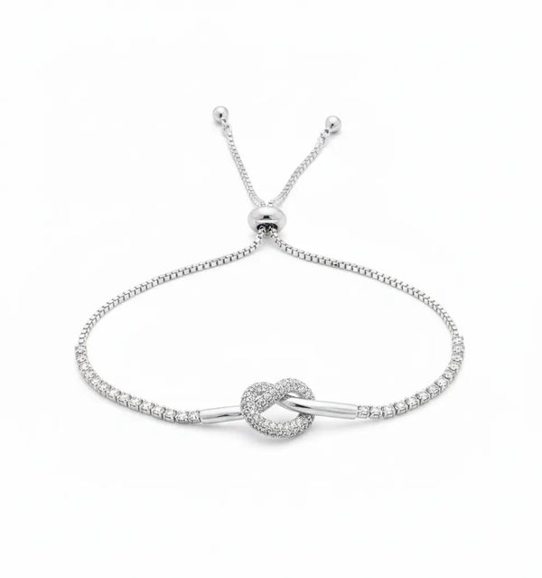 Silver Love Knot Bracelet – Adjustable CZ Tennis Chain by AurviJewelry